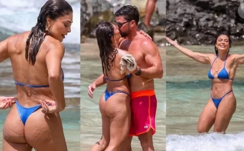 Gata, bronzeada e cheia de amor! De biquíni fio-dental, Juliana Paes dá ‘beijo de cinema’ no marido em Noronha; corpo definido rouba cena